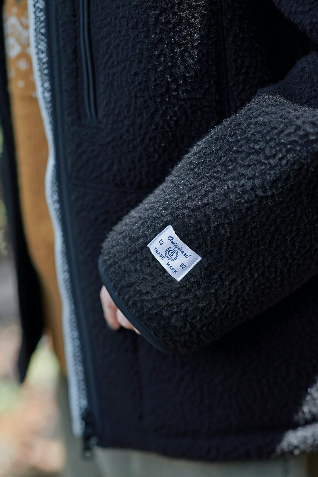 サニークラウズ|サニークラウズ　コタツフリースジャケット〈レディース〉|表面に表情のあるフリース生地で作ったジャケット。袖口のネームがアクセントになっています。